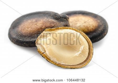 Dry Black Melon Seeds On White Background