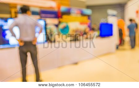 Blur Image Of People At Eletronic Department Store With Bokeh