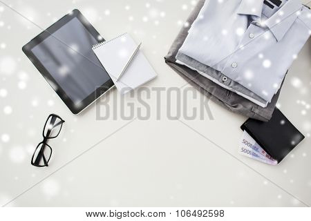 business, style, clothes and objects concept - close up of formal male clothes and personal stuff on table at home over snow effect over snow effect