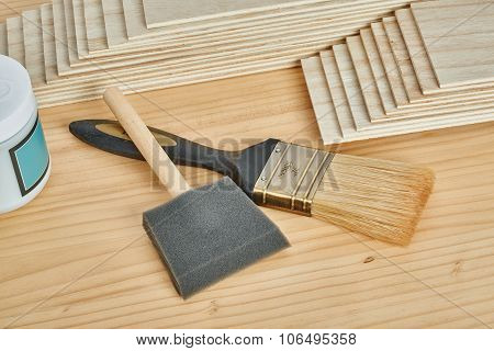Sandpaper Holder, Stack Of Veneers And Paint Brushes