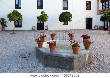 Warm Courtyard With Well Or Fountain In Spain