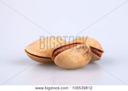 three almonds  on white background