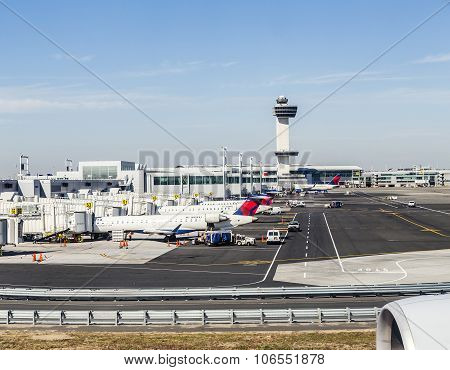 Air Traffic Control Tower And Terminal 4 With Air Planes At The Gates In Jfk Airport