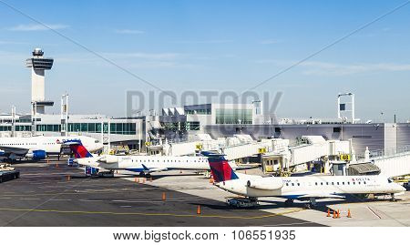 Air Traffic Control Tower And Terminal 4 With Air Planes At The Gates In Jfk Airport