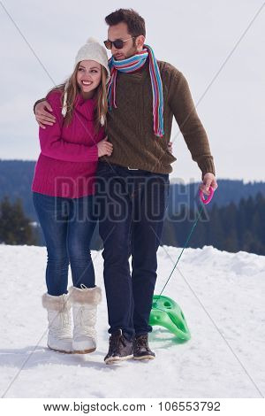 romantic winter  scene, happy young couple having fun on fresh show on winter vacatio, mountain nature landscape