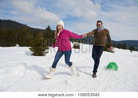 romantic winter  scene, happy young couple having fun on fresh show on winter vacatio, mountain nature landscape