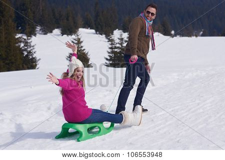 romantic winter  scene, happy young couple having fun on fresh show on winter vacatio, mountain nature landscape