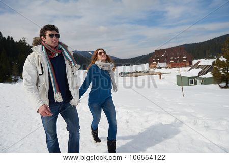 romantic winter  scene, happy young couple having fun on fresh show on winter vacatio, mountain nature landscape