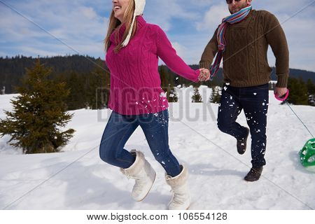 romantic winter  scene, happy young couple having fun on fresh show on winter vacatio, mountain nature landscape