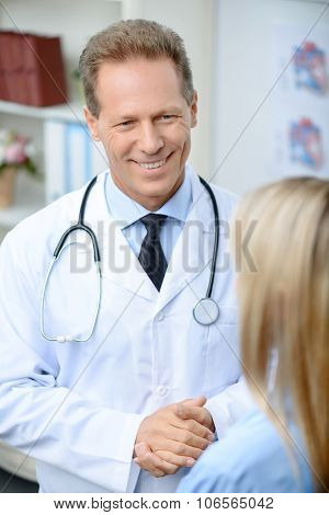 Professional doctor talking with his patient
