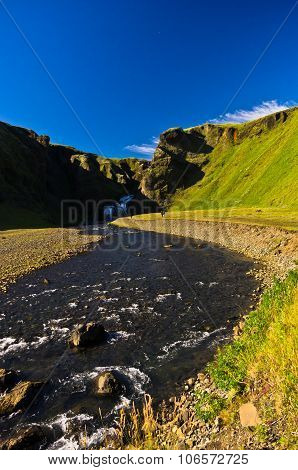 River and waterfall near old village at Kirkjubaejarklaustur