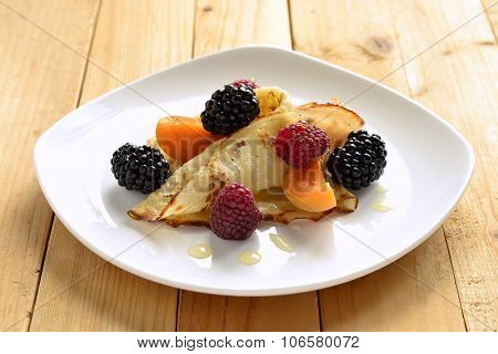crepes fresh berries and honey