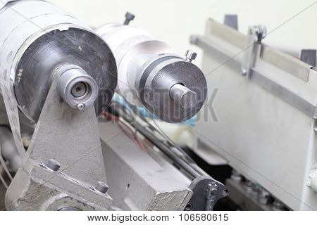 Rolling Machine With Paper In Printing Workshop