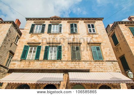 Wide angle shot of the houses facades on Stradun street in Dubrovnik, Croatia