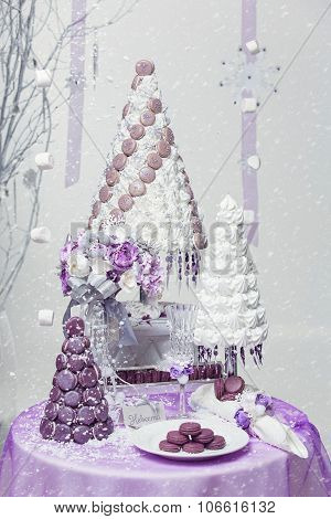 Big wedding cake on lightly decorated background.