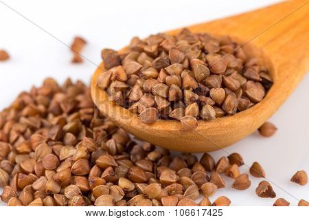 Uncooked Buckwheat On Wooden Spoon