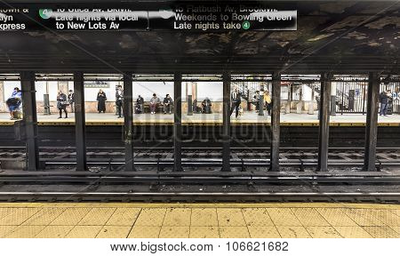 People Wait At Subway Station Wall Street