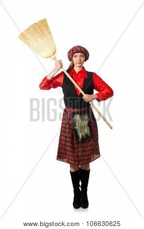 Funny woman in scottish clothing with broom