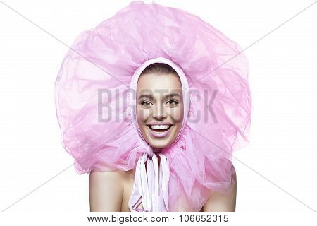 Beautiful happy girl with pink veil around head