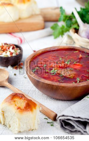 Traditional Ukrainian Russian vegetable soup, borsch with garlic donuts, pampushki .