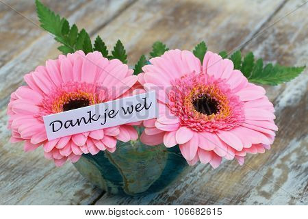 Dank je wel (which means thank you in Dutch) with pink  gerbera daisies