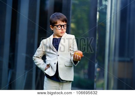 Cute little schoolboy feeling excited about going back to school