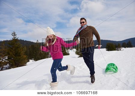 romantic winter  scene, happy young couple having fun on fresh show on winter vacatio, mountain nature landscape