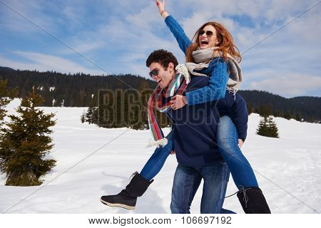 romantic winter  scene, happy young couple having fun on fresh show on winter vacatio, mountain nature landscape