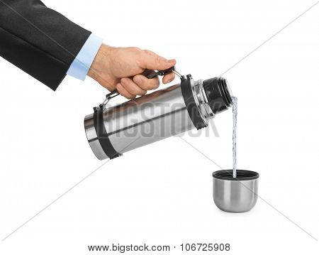 Hand and thermos flask isolated on white background