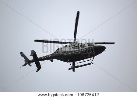 NYPD Bell 429 helicopter in the sky providing security during New York City Marathon start