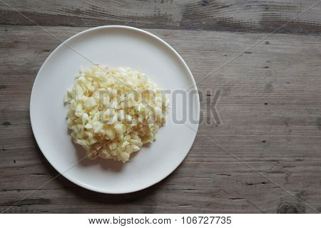ground fresh garlic on white plate