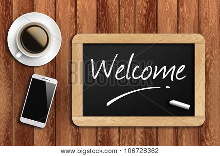 Coffee, Phone  And Chalkboard With  Word Welcome