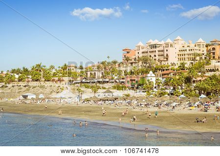 Sandy Beach With Thatched Parasols And Sunbeds, Costa Adeje, Tenerife, Spain