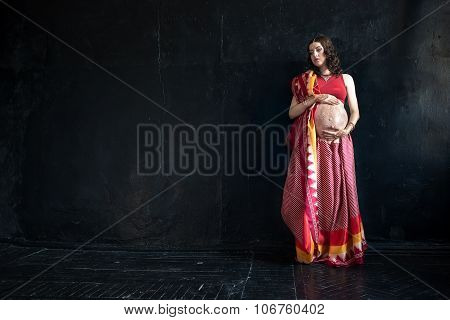 The pregnant woman with henna tattoo