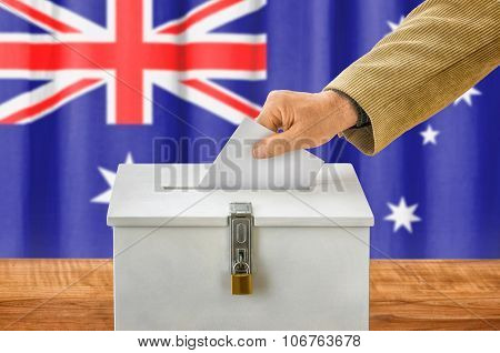 Man Putting A Ballot Into A Voting Box - Australia