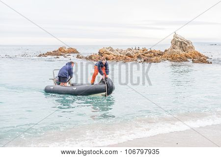 Inflatable Boat Beaching At The Doornbaai Harbor