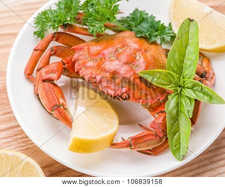 Seafood dish - cooked crab with lemon and herbs.
