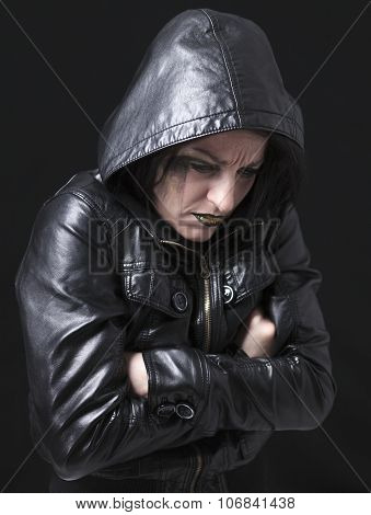 A gothic woman over a dark background,