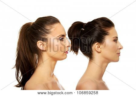 Beauty woman with make up standing behind her friend.