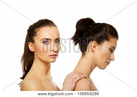 Beauty woman with make up standing behind her friend.