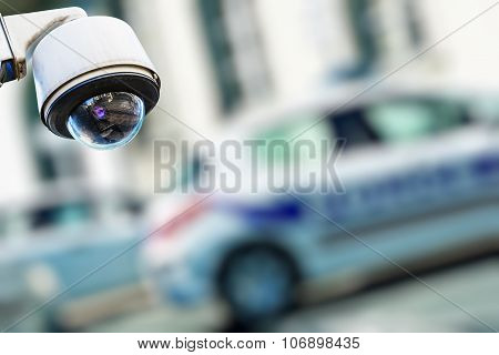 Security Camera And Urban Video With Blur Police Car On Background
