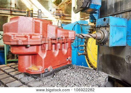 Metalworking industry. massive cast iron body detail under cutting process on moderm machining center 