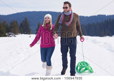 romantic winter  scene, happy young couple having fun on fresh show on winter vacatio, mountain nature landscape