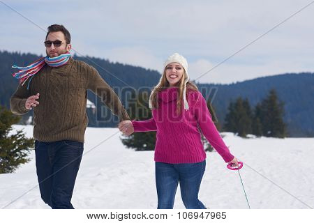 romantic winter  scene, happy young couple having fun on fresh show on winter vacatio, mountain nature landscape