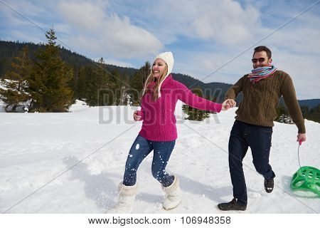 romantic winter  scene, happy young couple having fun on fresh show on winter vacatio, mountain nature landscape