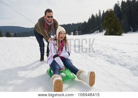 romantic winter  scene, happy young couple having fun on fresh show on winter vacatio, mountain nature landscape