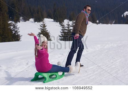 romantic winter  scene, happy young couple having fun on fresh show on winter vacatio, mountain nature landscape