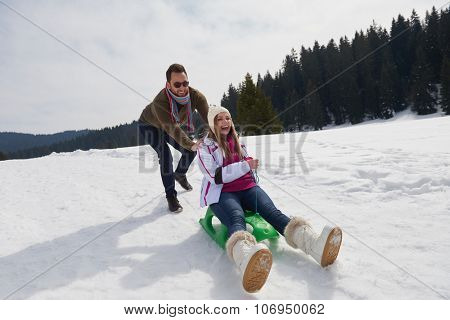 romantic winter  scene, happy young couple having fun on fresh show on winter vacatio, mountain nature landscape