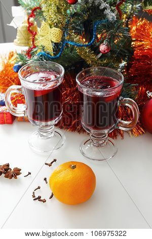 mulled wine with decorated christmas tree