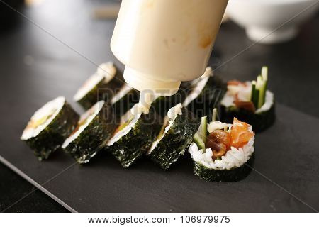 Sushi master preparing sushi in Japanese restaurant